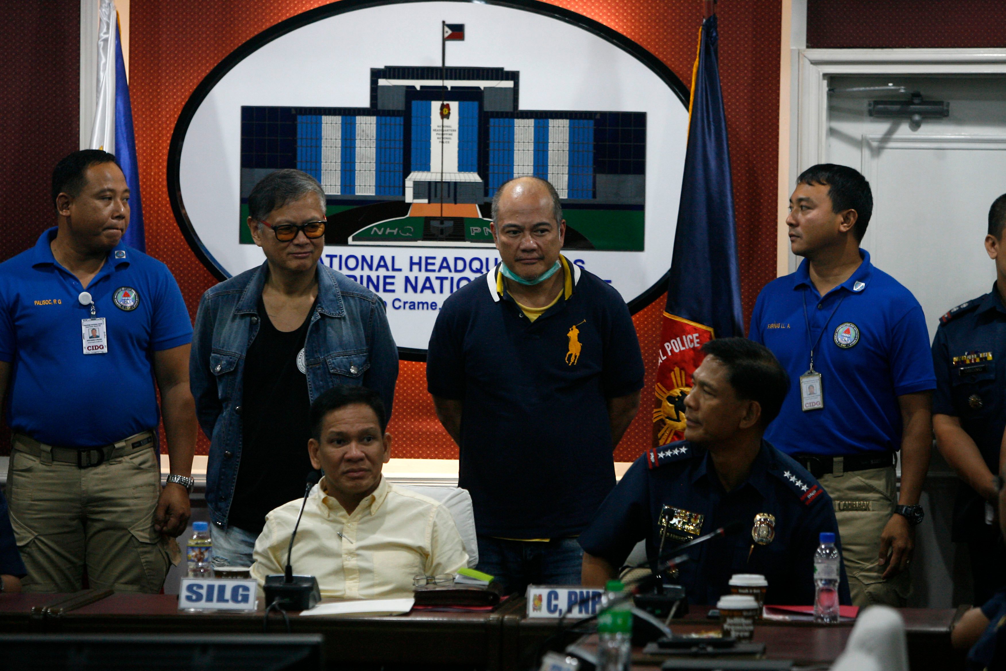 CAUGHT. The Reyes brothers Joel (left) and Mario are presented to the media by PNP chief Director General Ricardo Marquez and Interior Secretary Mel Sarmiento. Photo by Ben Nabong/Rappler 