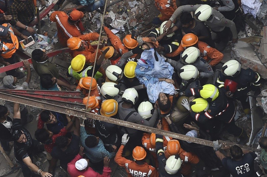 Woman rescued as death toll rises in Mumbai building collapse