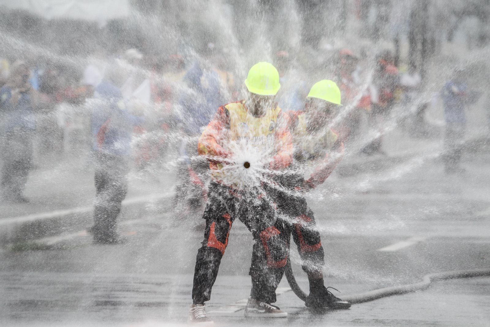 AWARENESS GAMES. Firefighters from Sulu train a firehose as they try to extinguish a fire during a competition at the 5th National Fire Olympics at Quirino Grandstand in Manila on March 13, 2019. Photo by Ben Nabong/Rappler  