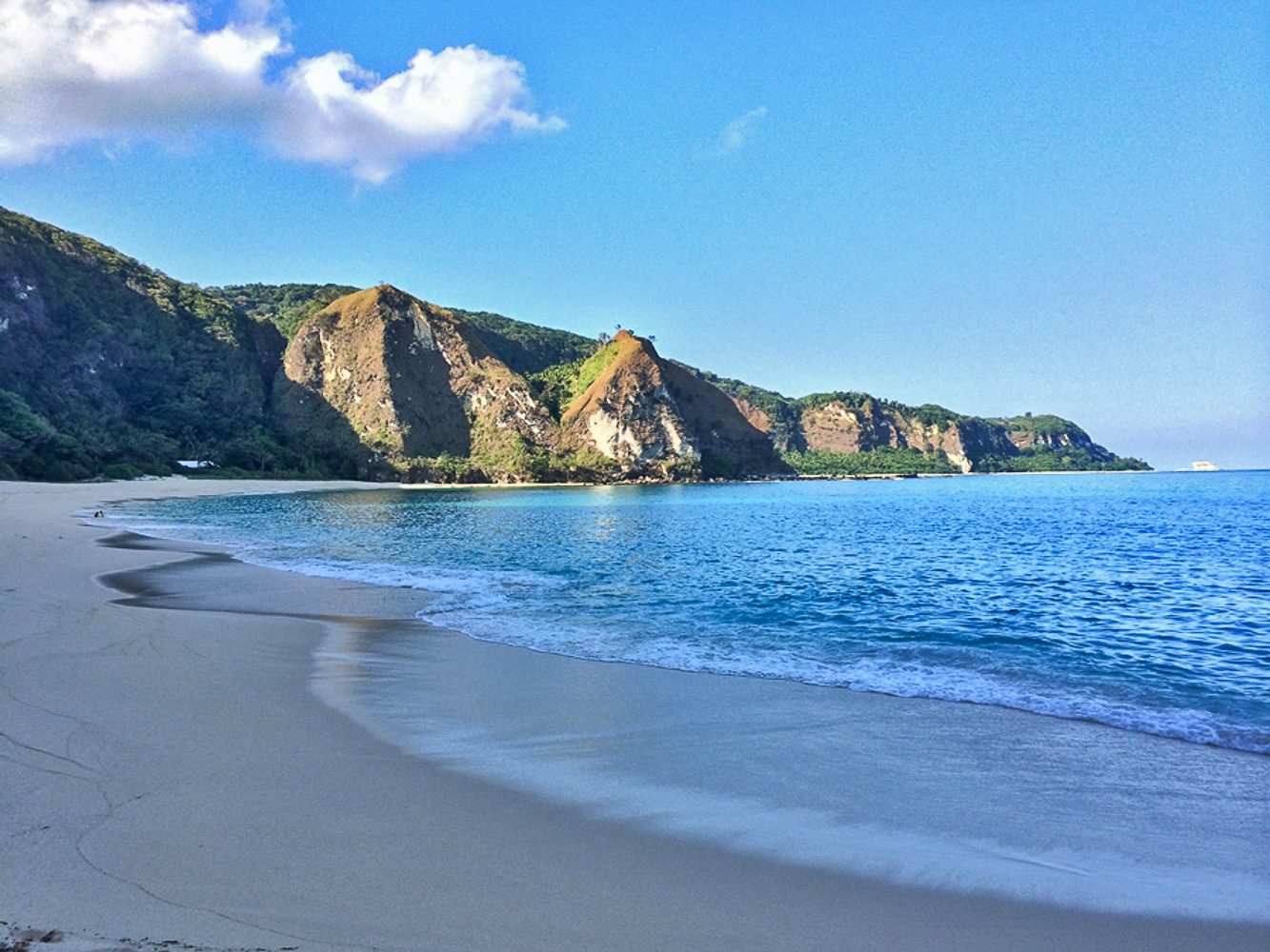 QUIET COVE. Walk barefoot on the pristine sand and take a dip in the clear waters of Cibang Cove. Photo by Marky Ramone Go 