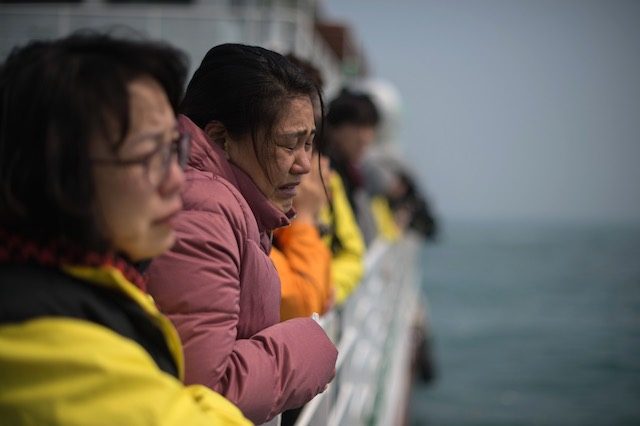 Flowers and tears as families mourn South Korea ferry dead
