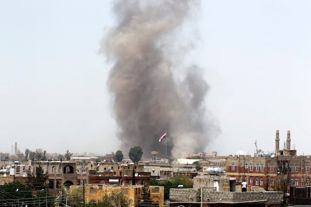 Smoke rises above the military academy following an airstrike carried out by the Saudi-led alliance, in Sanaa, Yemen, April 11, 2015. Yahya Arhab/EPA 