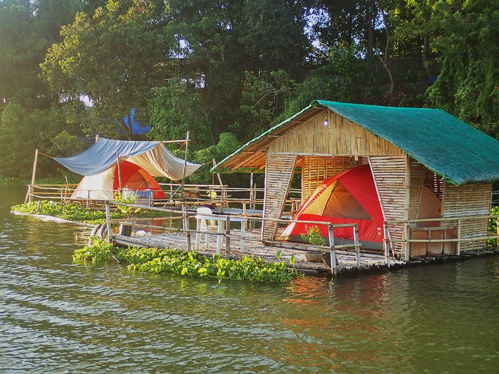 GLAMPING BY THE RIVER. Enjoy glamping with a twist by staying in tents on bamboo rafts like these. You get a front row to the sunrise and sunset!  