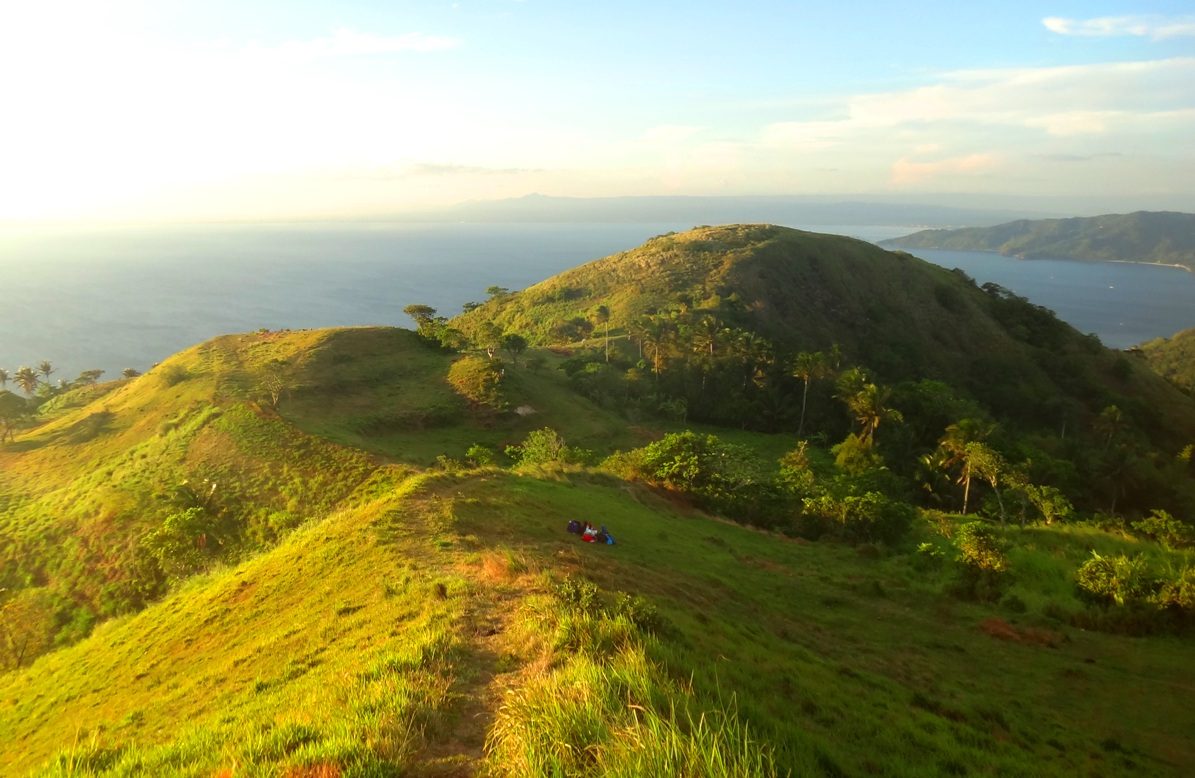 SUMMIT VIEW. Look down at rolling green hills and blue seas from Gulugod Baboy's peak.  