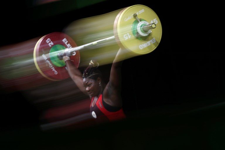 FINAL LIFT. Cameroon's Clementine Meukeugni Noubissi competes during the women's 90kg weightlifting final at the 2018 Gold Coast Commonwealth Games in Gold Coast on April 9, 2018. Photo by Adrian Dennis/AFP  