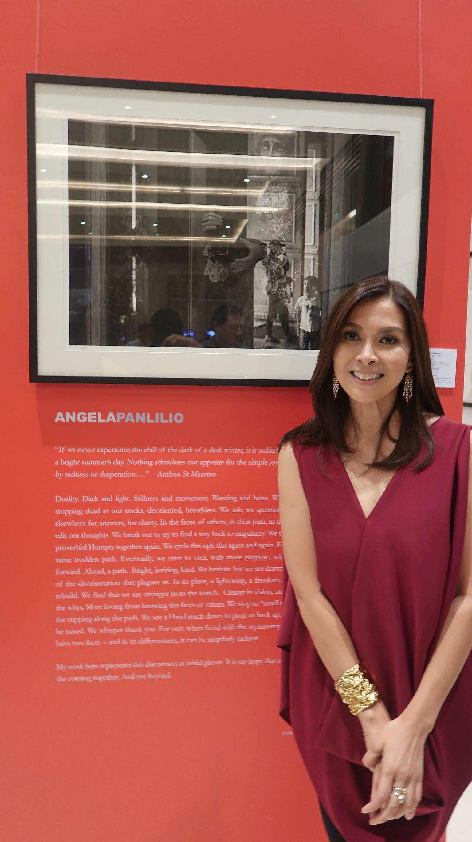 I SURRENDER. Angela Panlilio and her photo at the exhibit. Photo by Precious del Valle/Rappler 