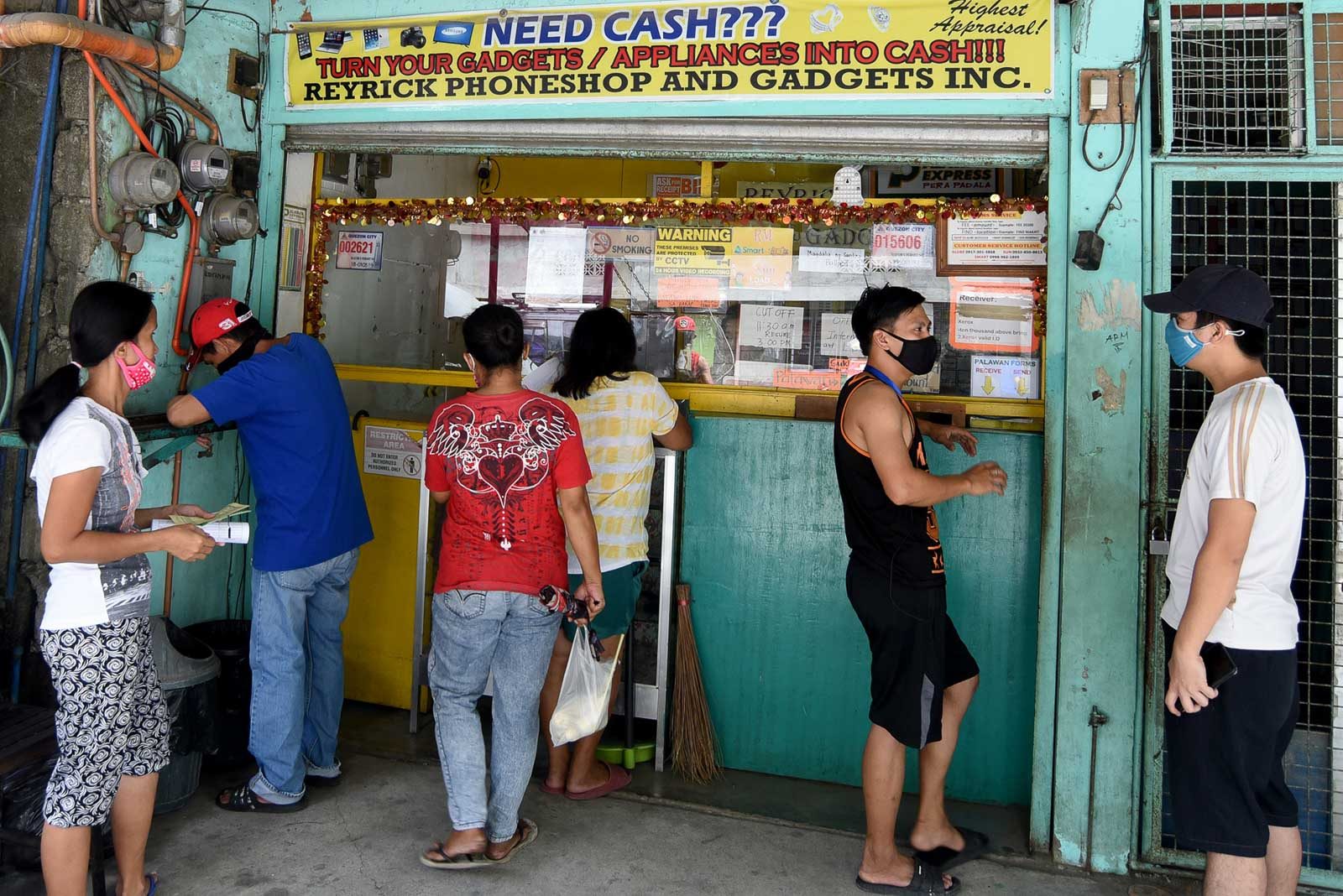 Quezon City allows loan facilities for poor to operate during lockdown