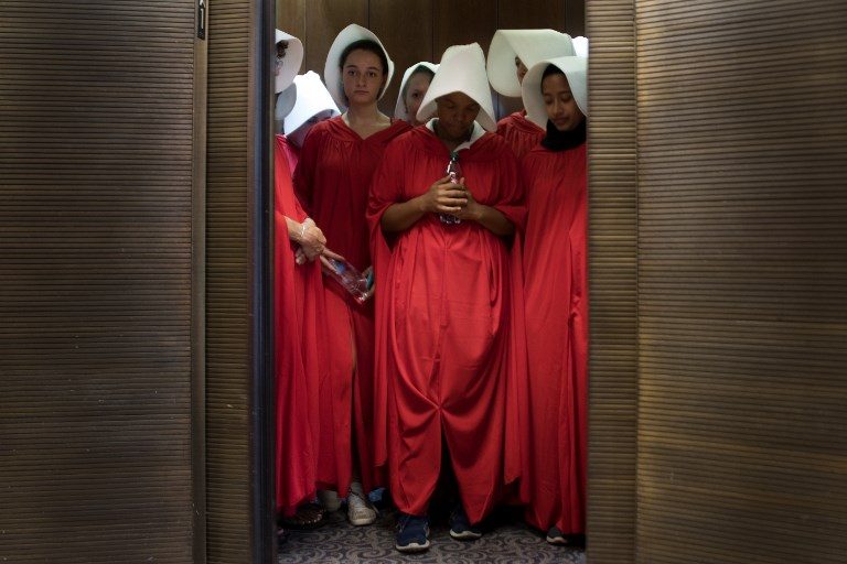 ABORTION HEARING. Women dressed as characters from the novel-turned-TV series "The Handmaid's Tale" stand in an elevator at the Hart Senate Office Building as Supreme Court nominee Brett Kavanaugh starts the first day of his confirmation hearing in front of the US Senate on Capitol Hill in Washington DC on September 4, 2018. Photo by Jim Watson/AFP  
