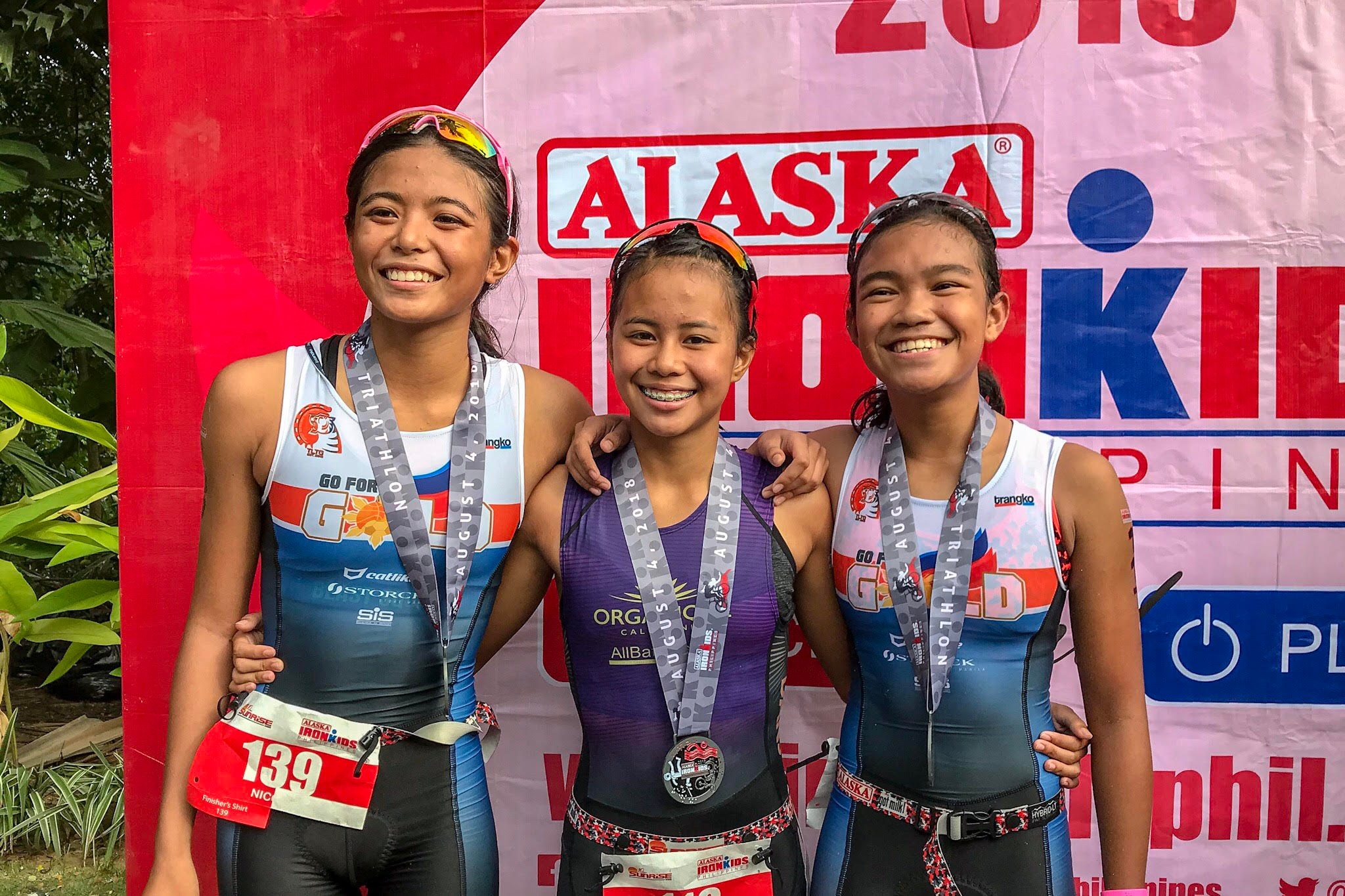 CEBUANA DOMINATION. Champion Moira Erediano (center) leads the Cebu sweep of the 13-14 girls podium with Nicole del Rosario (left) and Jeanna Canete. Photo by Beatrice Go/Rappler  