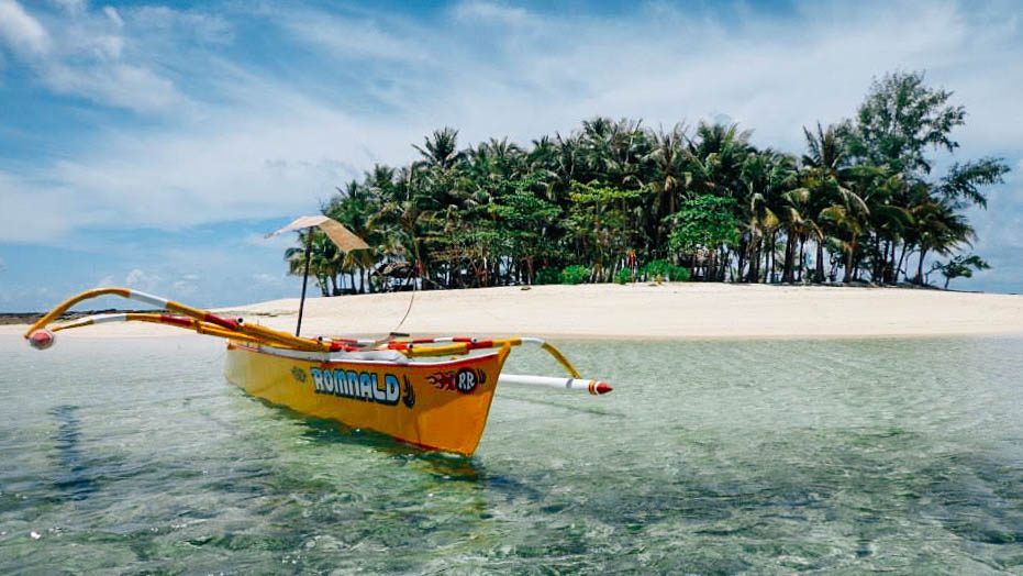 SCENIC. Guyam Island may be small, but its idyllic beauty makes up for it. Photo by Joshua Berida  