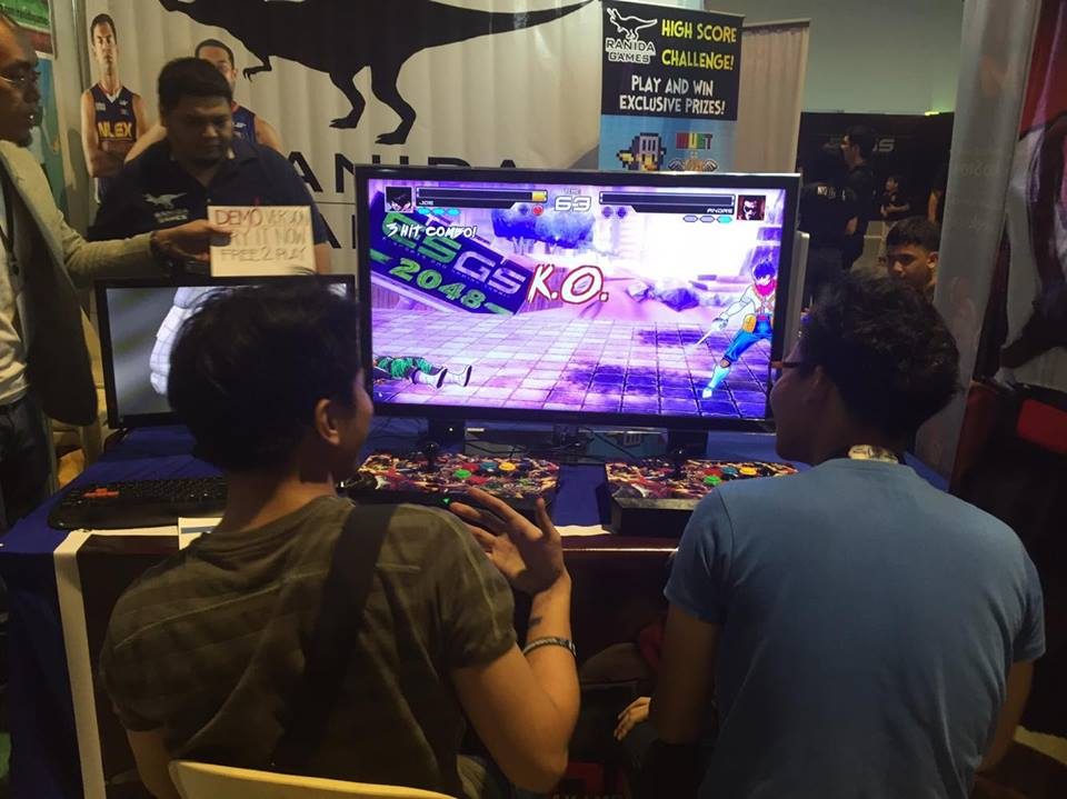 Guests trying out a demo of 'Bayani,' a Filipino-made fighting game by Laguna-based Ranida Games. Photo by Don Kevin Hapal 