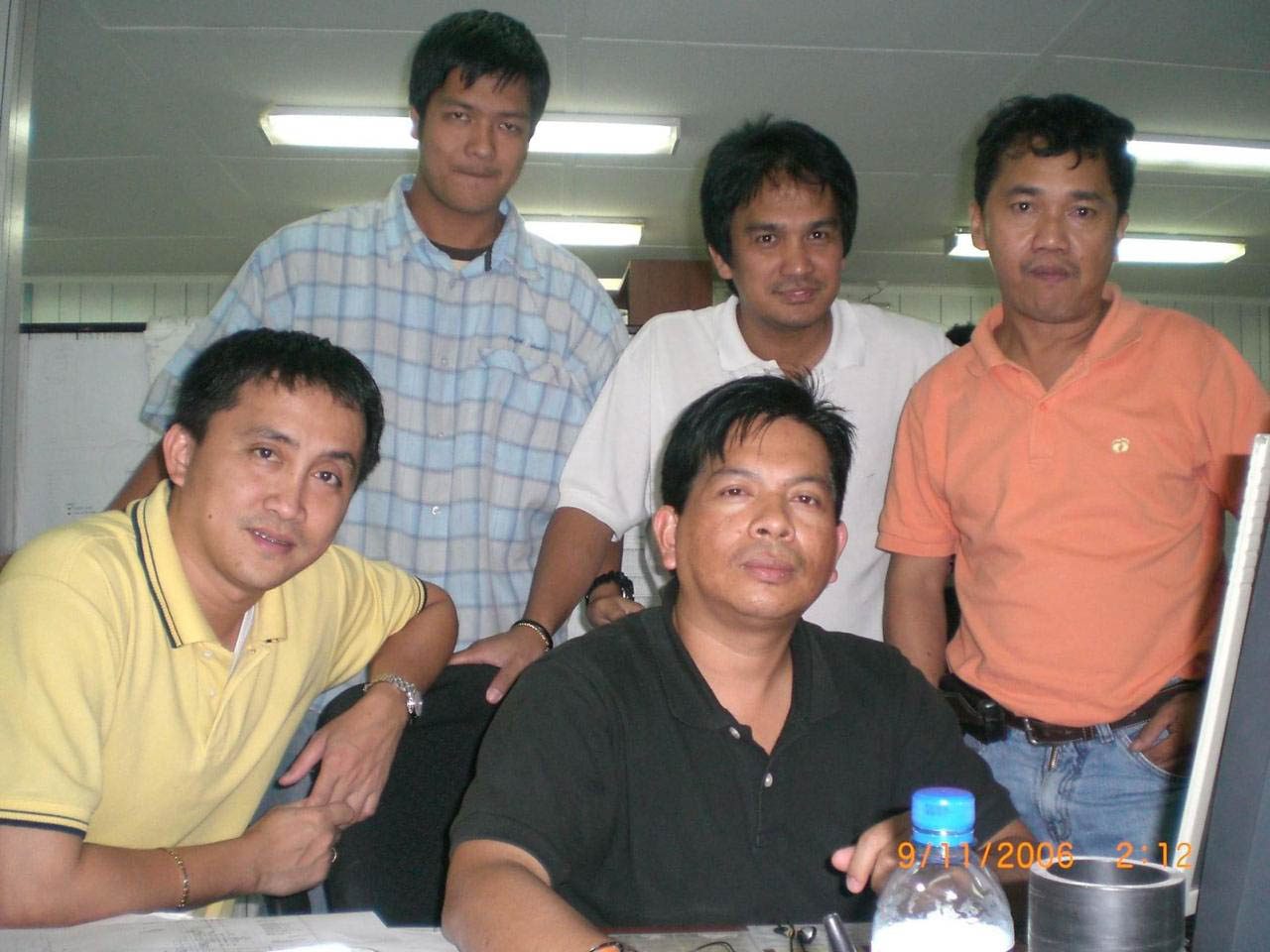 WORKMATES. Engr Mario Vilela Mercado, seated, right, with Engr Arnel Caburnay, seated with him, and friends. Photo contributed by Arnel Caburnay 