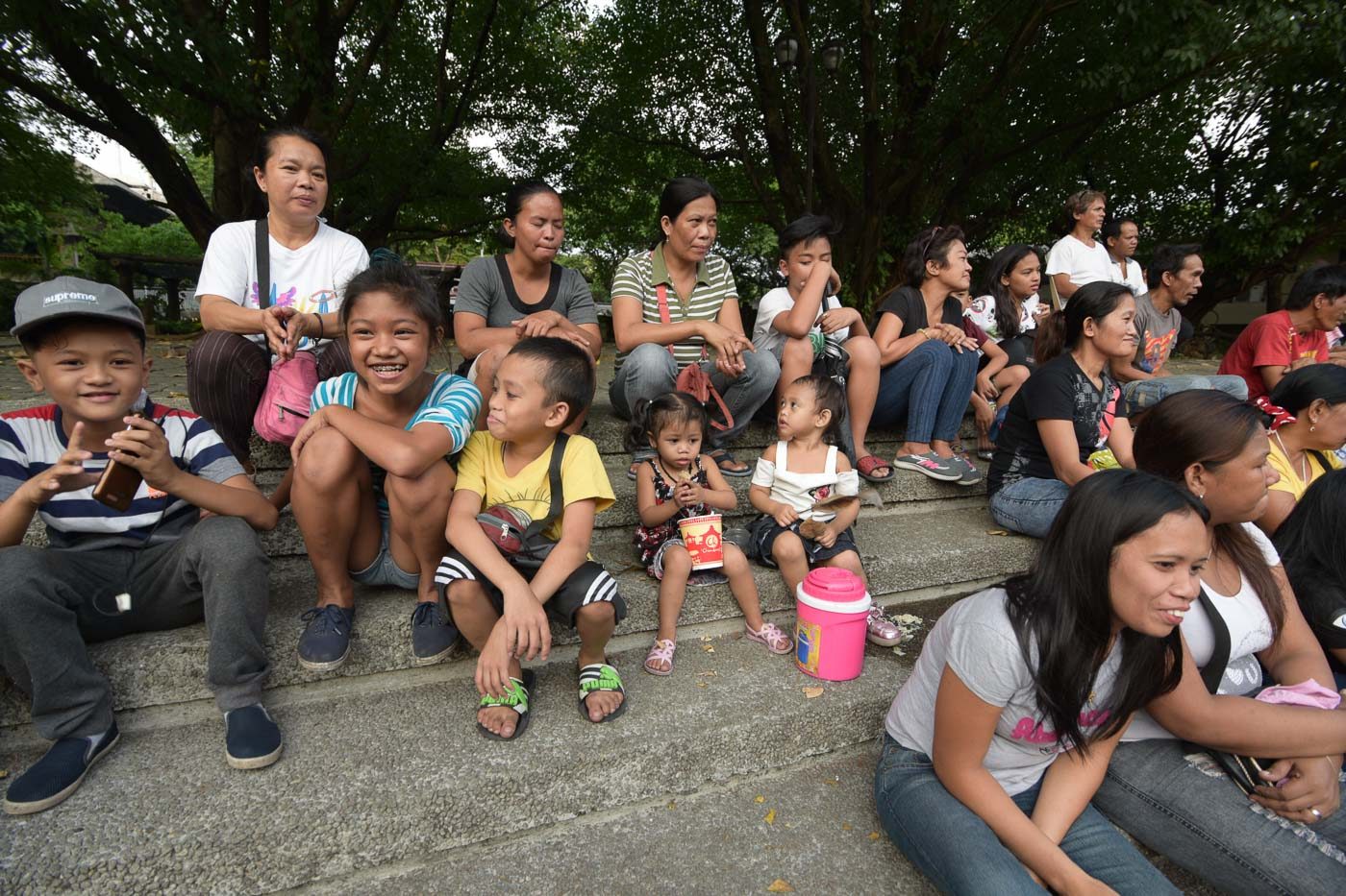 ORPHANS. Relatives of victims of the government's drug war attend the Maundy Thursday mass. 