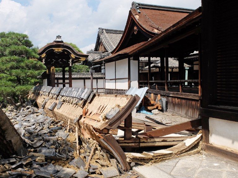 This photo shows a wall of the South Noh stage at Nishi Honganji temple damaged by Typhoon Jebi the day before in Kyoto on September 5, 2018. Photo by Jiji Press/AFP 
