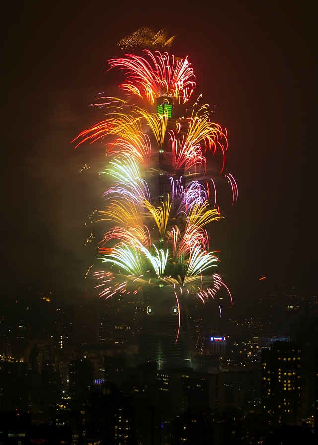 Fireworks go off at the Taipei 101 skyscraper to celebrate New Year 2016 in Taipei, Taiwan. This year's cross-year firework cost 45 million Taiwan dollars (1.4 million US Dollars). Photo by Ritchie B. Tongo/EPA  