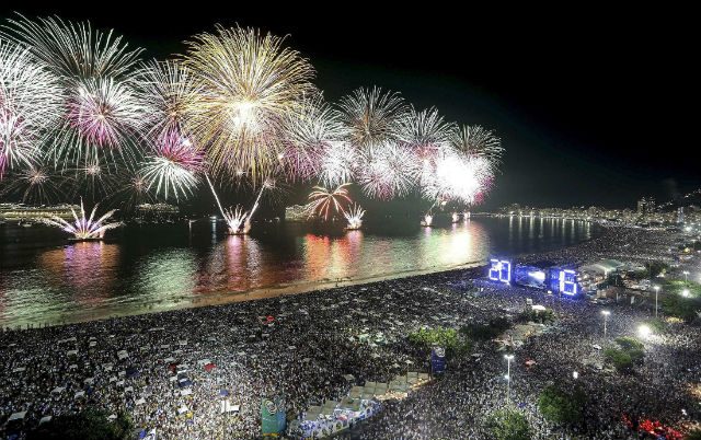 A handout picture made available by Riotur shows fireworks going off at Copacabana beach in Rio de Janeiro, Brazil, during New Year celebrations on January 1, 2016. Photo by Fernando Maia/EPA/Riotur  