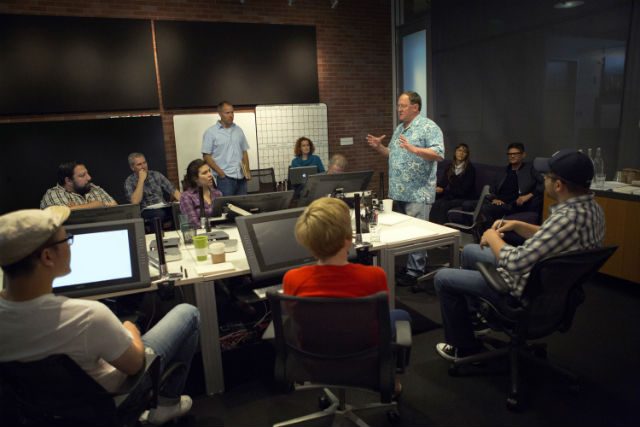 THE TEAM. John Lasseter with filmmakers and the Pixar team. Photo courtesy of Disney Pixar 