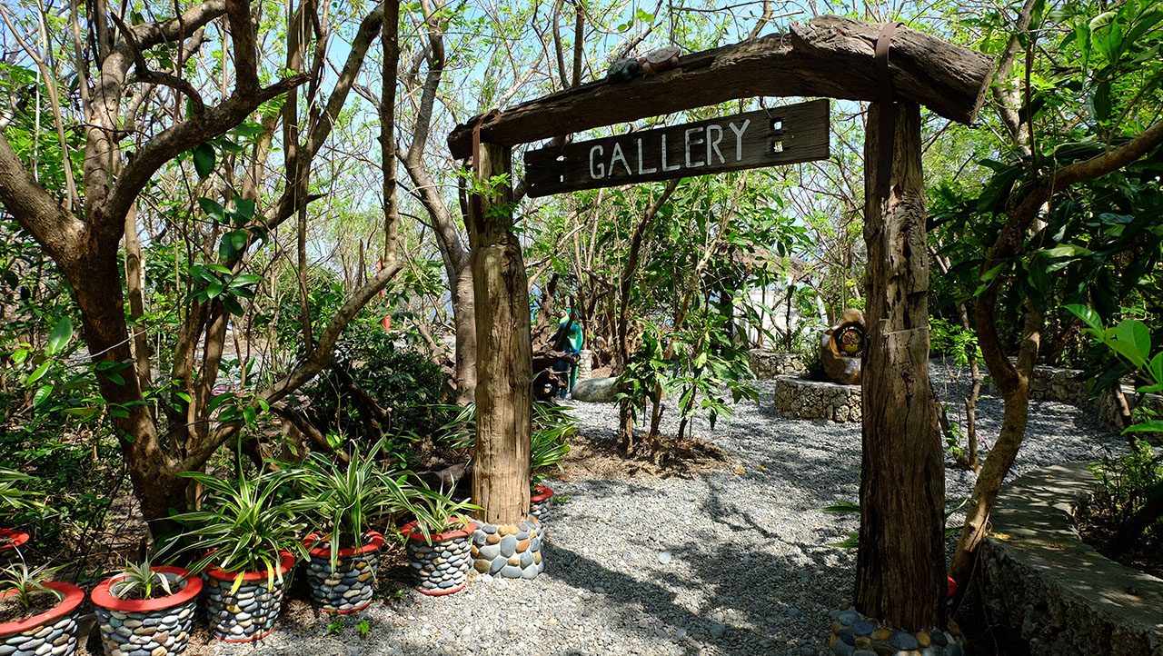 ART GALLERY. The entrance to the art gallery in Nalvo Norte, shaded by trees. Photo courtesy of Laurie Mae Gucilatar, Joms Santos and Eleazar Cuela    