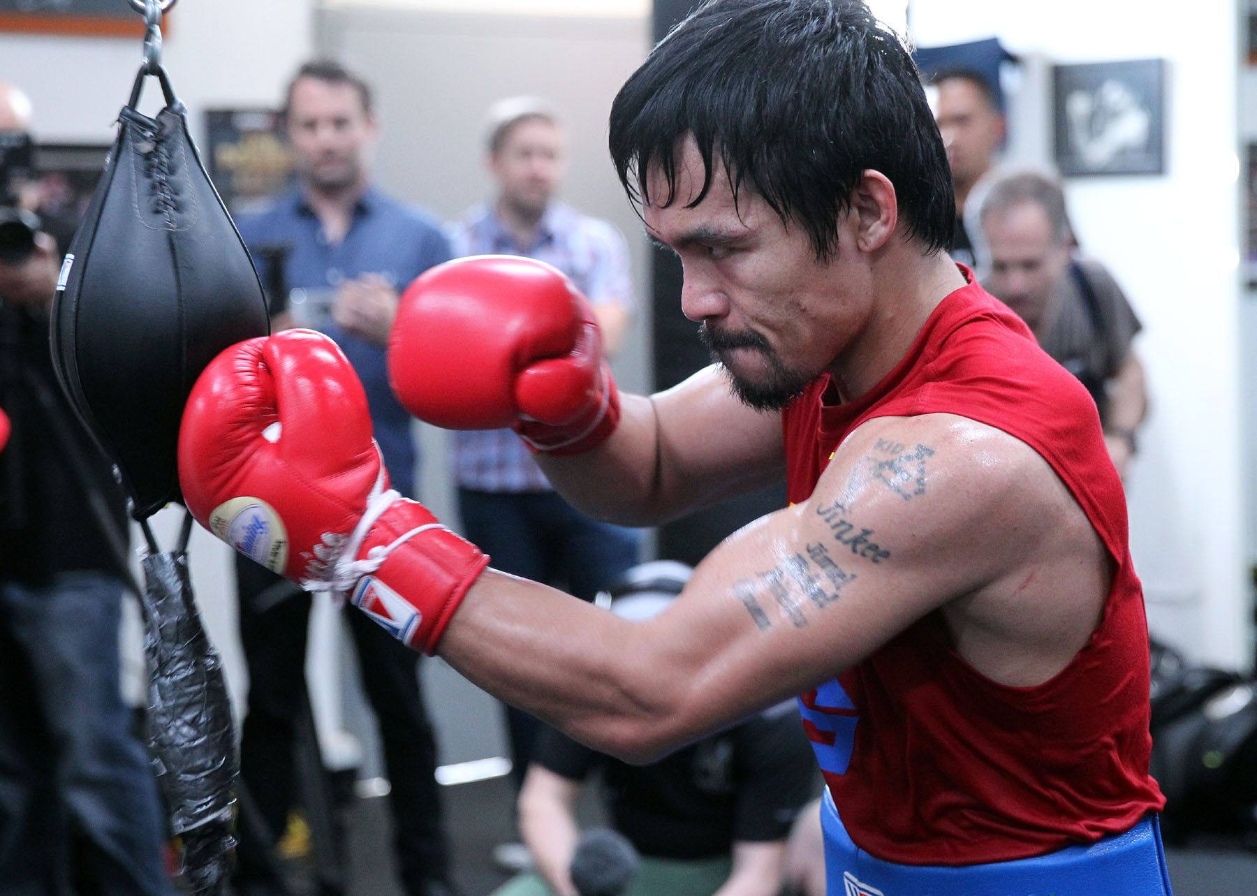 Media looks on as Manny Pacquiao works on the timing ball. Photo by Chris Farina/Top Rank 