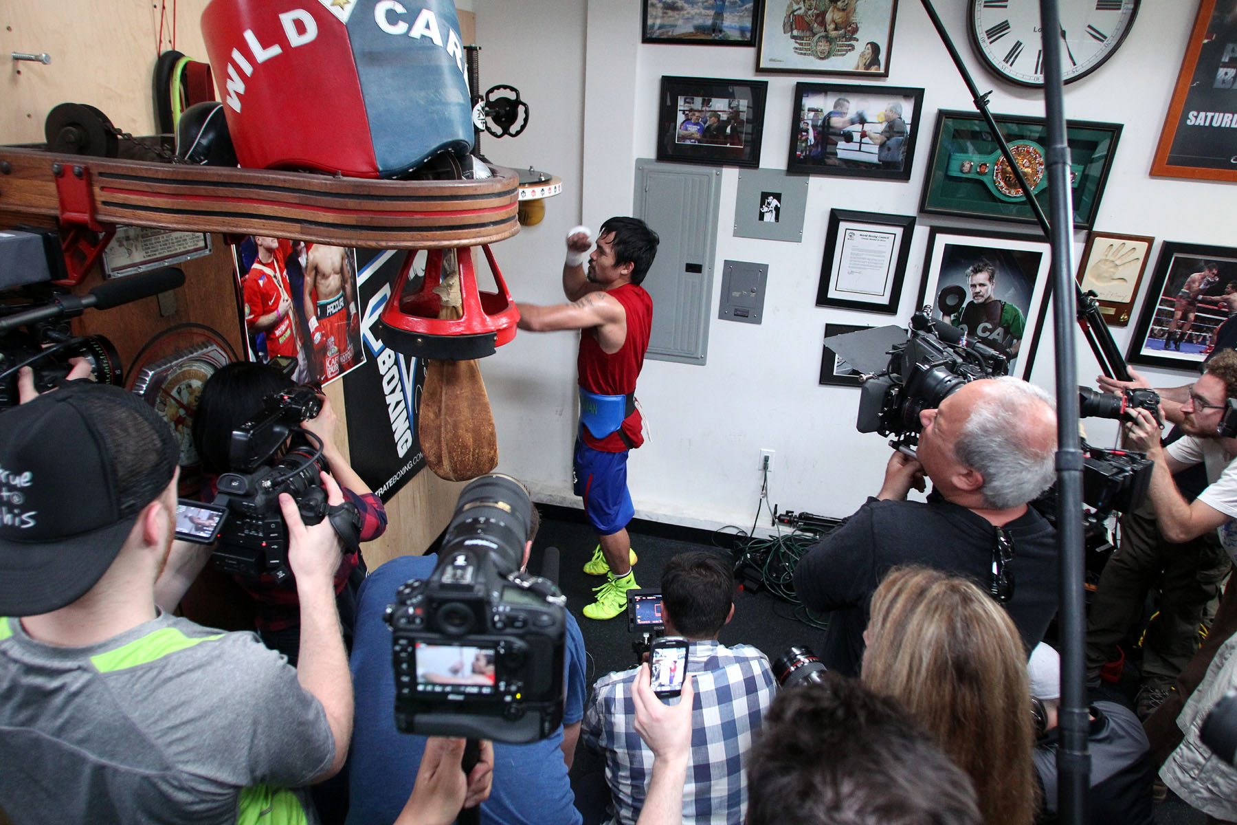 Manny Pacquiao being filmed by the media as he works on the speed ball. Photo by Chris Farina/Top Rank 