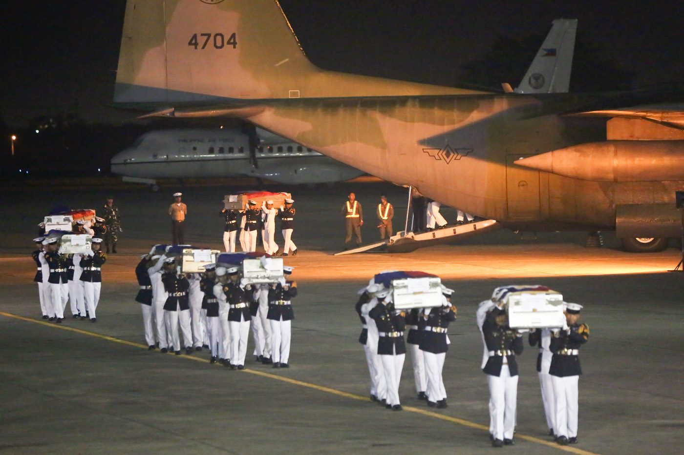 HEROES. The coffins of the first batch of soldiers and policemen killed in action in Marawi City arrive at Villamor Airbase in Pasay City. Malacanang Photo   