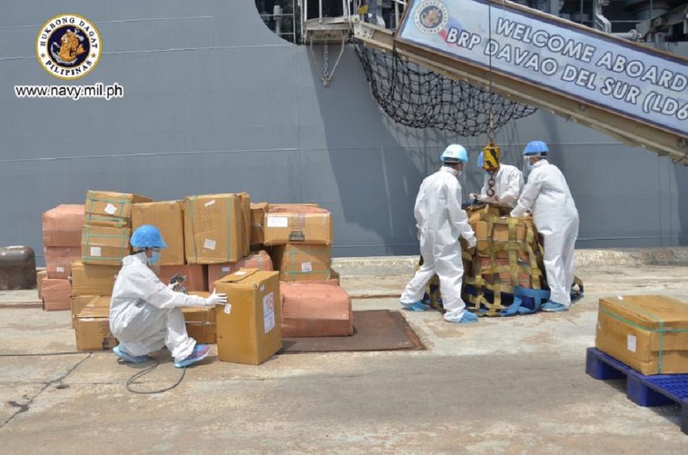 DONATIONS. Sailors from the Philippine Navy load boxes of face masks onto the BRP Davao del Sur. Photo from the Philippine Navy 