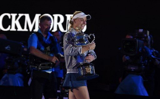 Emotional Wozniacki wins first Grand Slam title at Australian Open