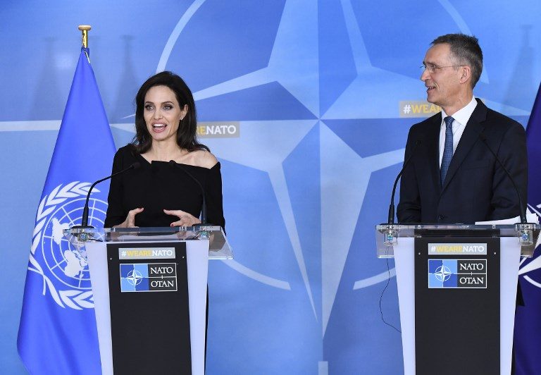 WORKING TOGETHER. Angelina Jolie (L) addresses a press conference after meeting with NATO Secretary General Jens Stoltenberg in Brussels on January 31, 2018, where she will work with them on combating sexual violence. Photo by Emmanuel Dunand/AFP
  