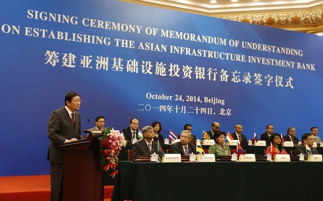 In this file photo, Chinese Finance Minister Lou Jiwei (L) gives a speech with the guests of the signing ceremony of the Asian Infrastructure Investment Bank in the Great Hall of the People in Beijing, China, 24 October 2014. EPA/Takaki Yajima / POOL  