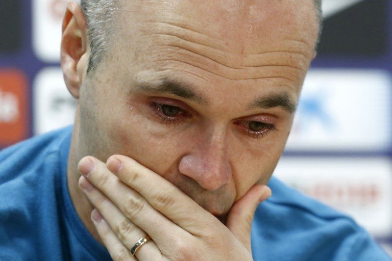 EMOTIONAL. Iniesta tries to hold back tears as he confirms leaving Barcelona at the end of the season. Photo by Pau Barrena/AFP   