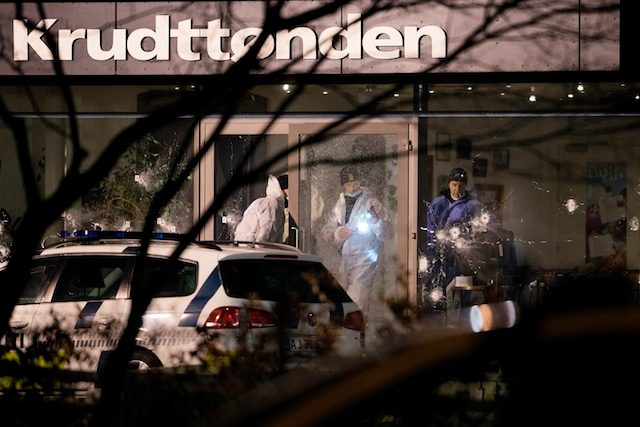 CRIME SCENE. Forensic experts look for clues at the scene in front of the Krudttoenden cafe, where shots were reportedly fired during a discussion meeting about art, blasphemy and free speech in Copenhagen, Denmark, 14 February 2015. Liselotte Sabroe/EPA 