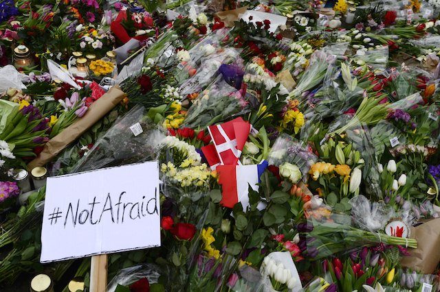 #NOTAFRAID. Flowers and candles left following shootings in the Danish capital, outside the Krudttonden cafe, the venue of a free speech event that was titled 'Art, Blasphemy and Freedom of Expression', in Copenhagen, Denmark, 16 February 2015. Soeren Bidstrup/EPA 