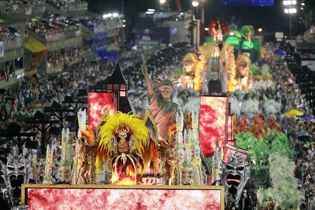 GRAND PARADE. Members of the Samba Mocidade Independente de Padre Miguel troupe perform during the carnival parade in the streets of Rio de Janeiro, Brazil, 15 February 2015. Luiz Eduardo Perez/EPA 