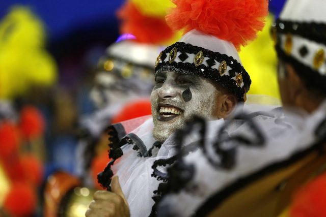 SMILE! Members of the samba school Sao Clemente perform during the second day of the parades of the special groups of the Carnival of Rio de Janeiro, at the Sambodromo in Rio de Janeiro, Brazil, 16 February 2015. Antonio Lacerda/EPA 
