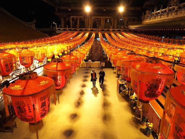 A young couple visit theTaoist temple Hsian Seh Gong in Sanchung, New Taipei City, Taiwan, 18 February 2015, on the eve of the Chinese New Year holidays, also called Spring Festival. David Chang/EPA 