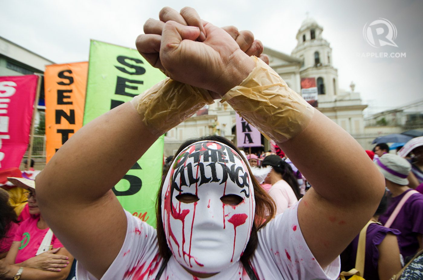 STOP THE KILLINGS. A woman protester portray a 'salvage' victim during the Plaza Miranda rally. 