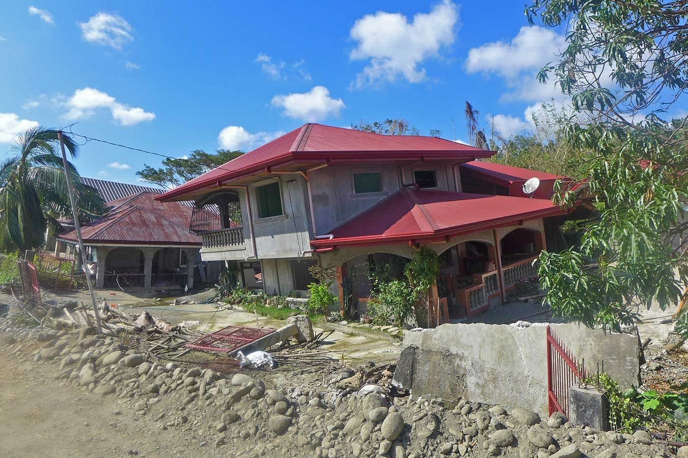 CRACKED. Houses in the upland village of Barangay Amguid in Ilocos Sur gradually rocked and cracked by continuous downpour during the month long monsoon rains last August. Photo by Mau Victa/Rappler   