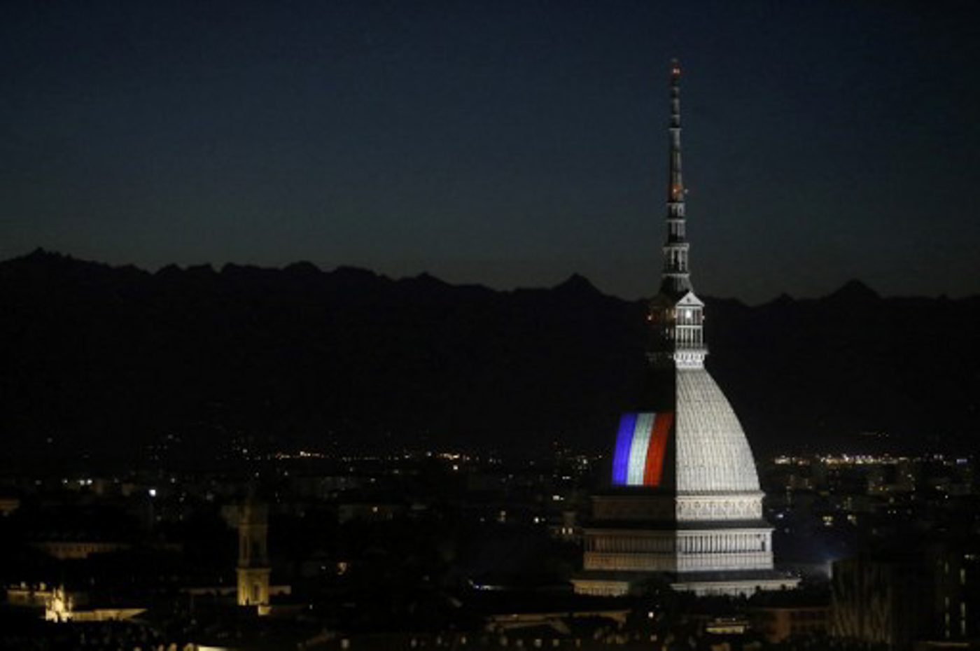 ITALY. The flag of France illuminates the Mole Antonelliana in Turin. 