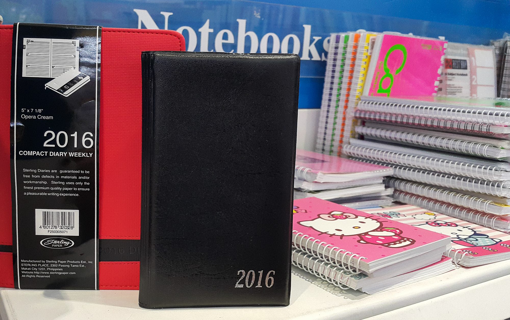 Sterling diaries, various sizes. Red diary at P239.75, black planner at 99.75. Rappler photo 