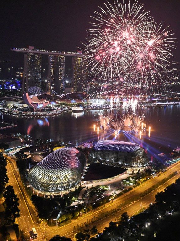 New Year fireworks burst over the Marina Bay skyline in Singapore on January 1, 2017. Photo by Roslan Rahman/ AFP 