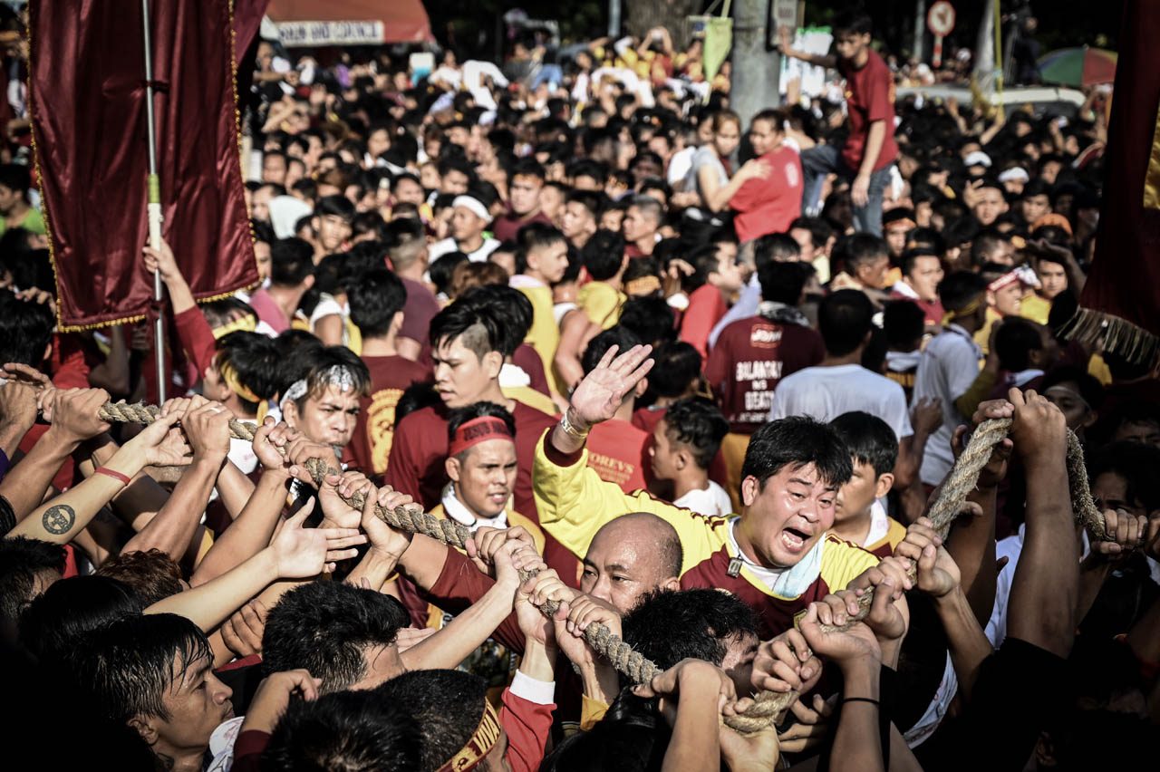 PULL. The devotees pull the rope attached to the carriage bearing the image of the Black Nazarene. Photo by Alecs Ongcal  