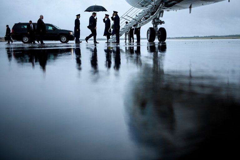 POTUS. US President Donald Trump (center) boards Air Force One at Andrews Air Force Base July 24, 2018, in Maryland. Photo by Brendan Smialowski/AFP  