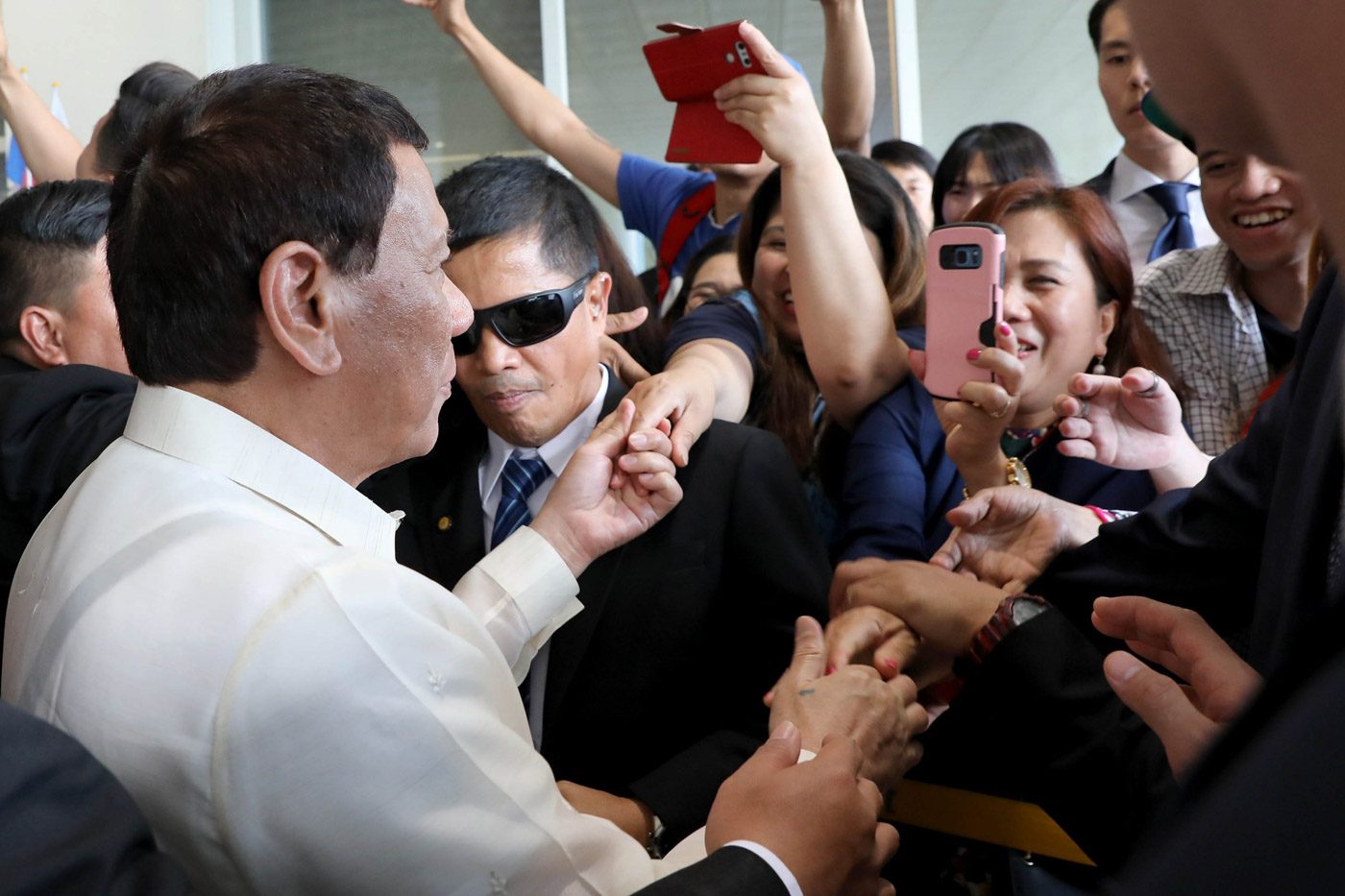 ‘Sickening’: Lawmakers react to Duterte kissing an OFW on the lips