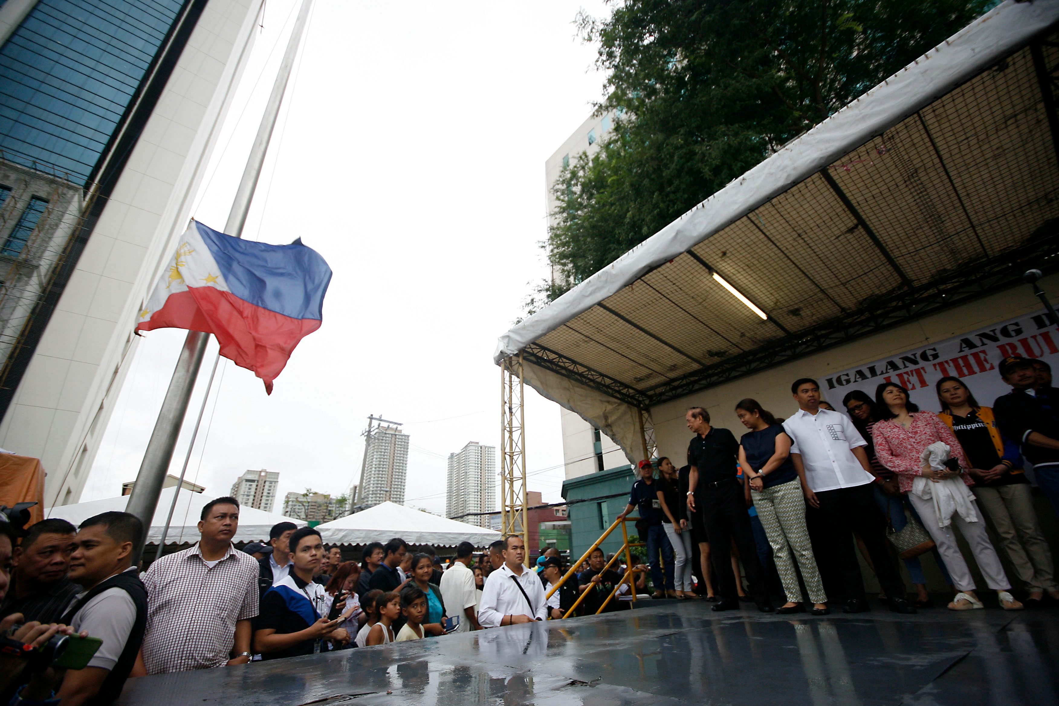 Makati City mayor Junjun Binay attends the flag raising ceremony with sister, Senator Nancy Binay, and other supporters at the new Makati city hall grounds on Monday. Photo by Ben Nabong/Rappler 