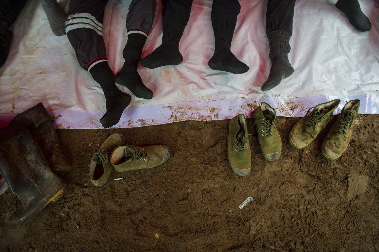 TIRED FEET. Thai volunteers rest amid rescue operations for 12 boys and their football team coach trapped in Tham Luang cave at the Khun Nam Nang Non Forest Park in the Mae Sai district of Chiang Rai province on July 7, 2018. Photo by Ye Aung Thu/AFP  