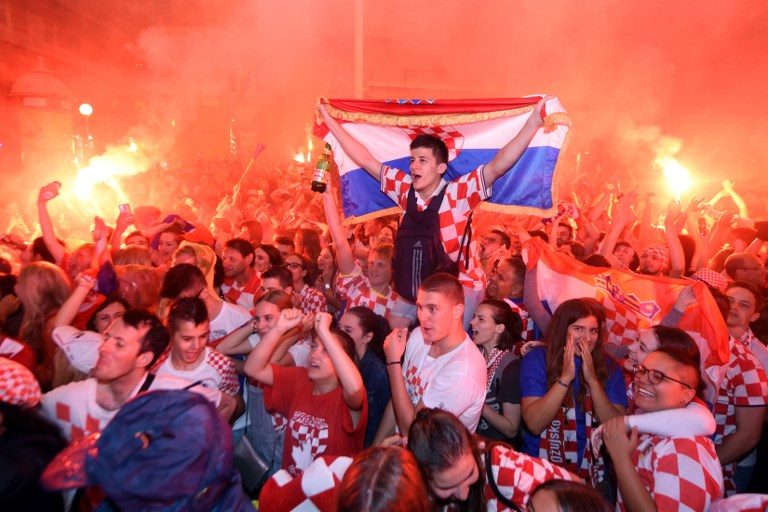 TO THE FINALS. Croatia's supporters celebrate the second goal as they watch on a giant screen the Russia 2018 World Cup semi-final football match between Croatia and England at the main square in Zagreb on July 11, 2018. Photo by Denis Lovrovic/AFP   