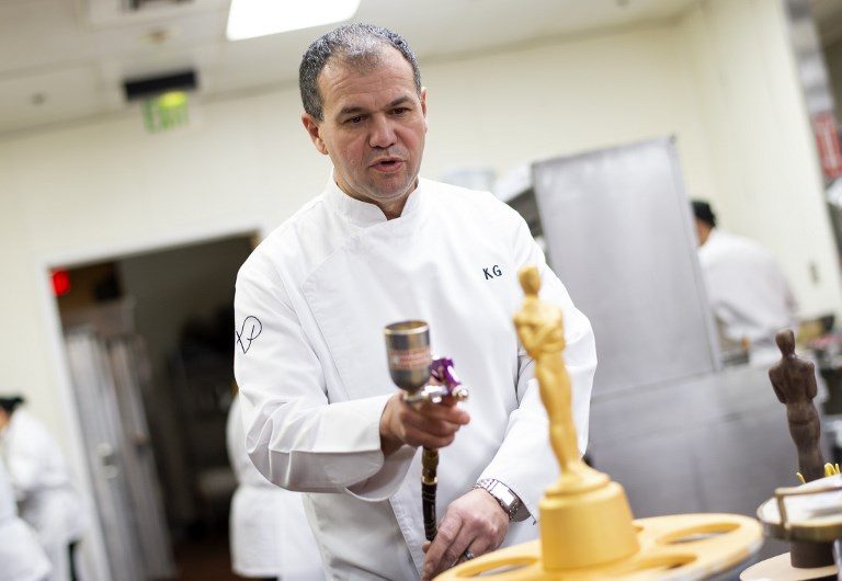 OSCAR PASTRY. Pastry chef Kamel Guechida does a Oscar statue inspired decoration for the 91st annual Academy Awards Governors Ball, in Hollywood, California. Photo by Valerie Macon/AFP 