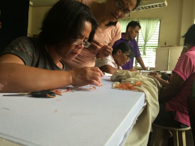WEAVES. These women work on the intricate details on the designs and patterns on an altar cloth. Photos provided by Louie Marie T. Jala