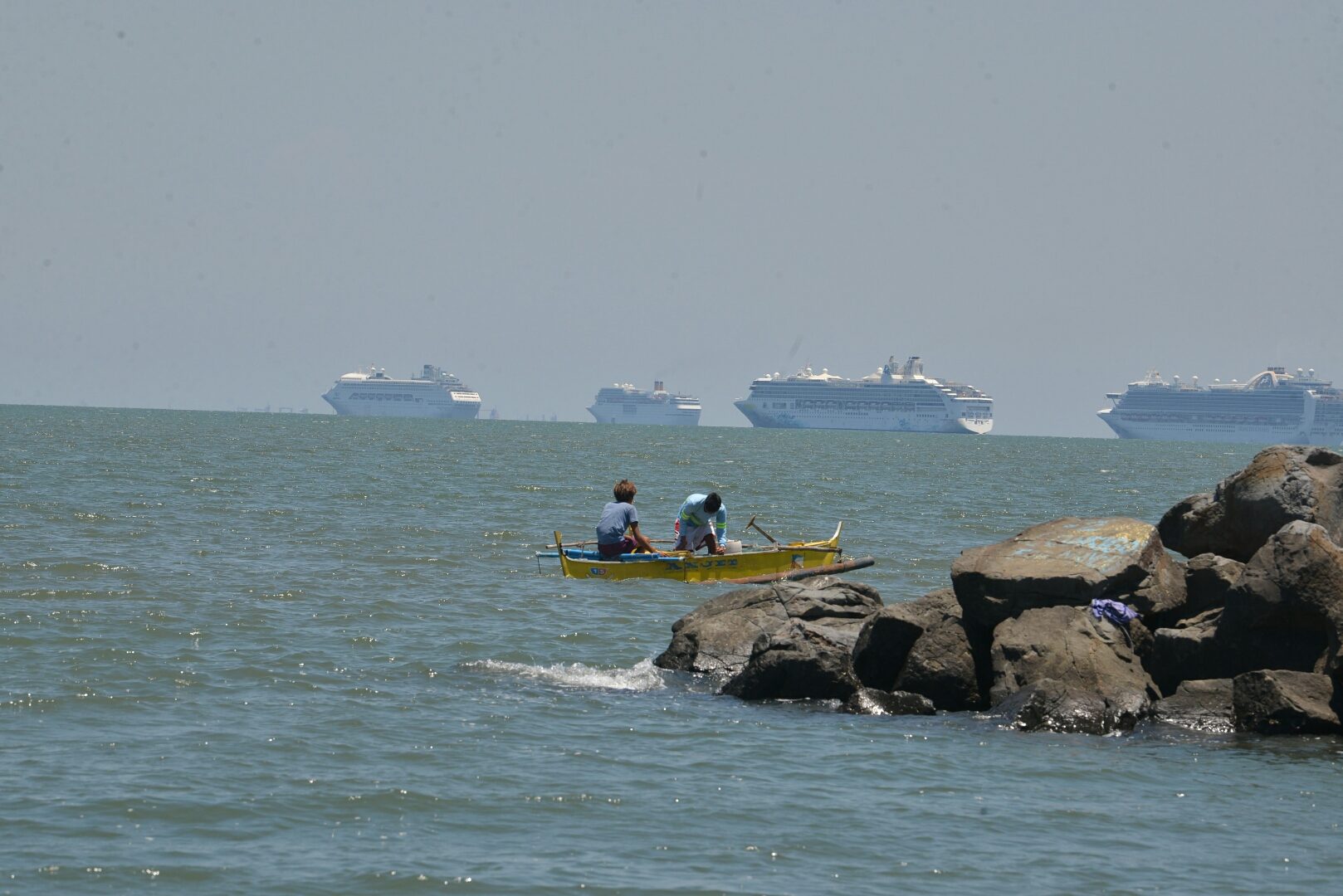LOOK: Cruise ship linked to coronavirus deaths anchored in Manila Bay