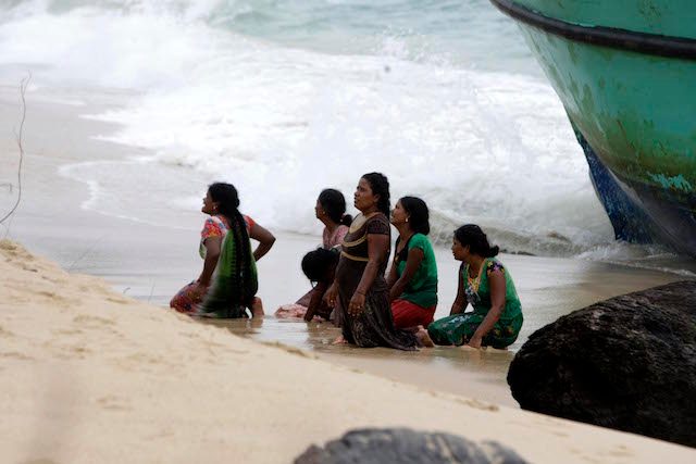 Migrants stranded in boat beg Indonesian officials to save them